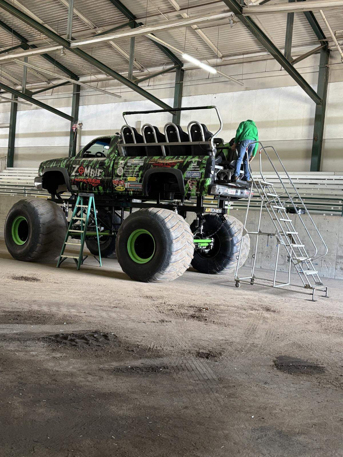 A worker gets one of the Monster Trucks prepped for the Spring Fair.