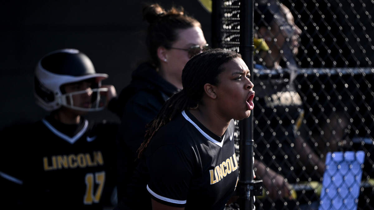 Lincoln Joy Wilde cheers as her teammates run during the game against Lakes at Lincoln High School, on Tuesday, April 30, 2024, in Tacoma, Wash.