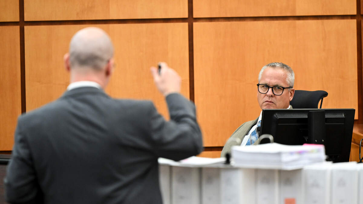 Defense attorney Jared Ausserer questions John J. Ryan, police use-of-force expert, on cross-examination Tuesday during the trial of three Tacoma police officers charged with killing Manny Ellis.