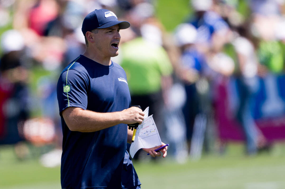 Seahawks head coach Mike Macdonald watches during the first day of training camp at the Virginia Mason Athletic Center, on Wednesday, July 24, 2024, in Renton, Wash.