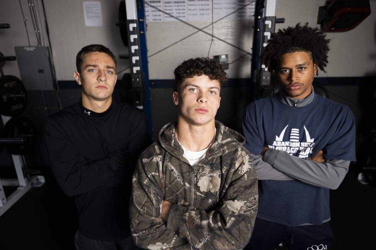 Cascade Christian’s Caleb Donahue, Donovan Walson and Tayven Collins pose for a portrait at Cascade Christian Schools on Wednesday, Oct. 29, 2025, in Puyallup, Wash.