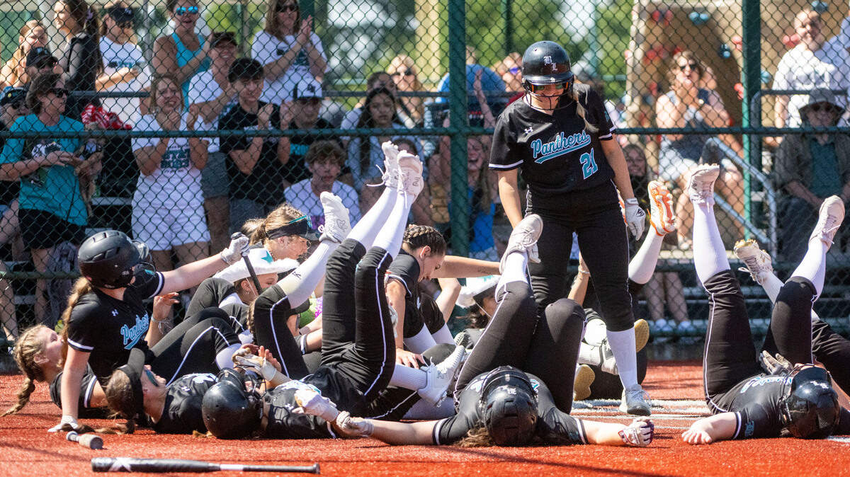 Bonney Lake players celebrate at home plate after Isabella Jones (21) hit a home run first inning of a second-round game of the Class 3A state softball tournament against Stanwood on Friday, May 26, 2023, in Lacey, Wash.