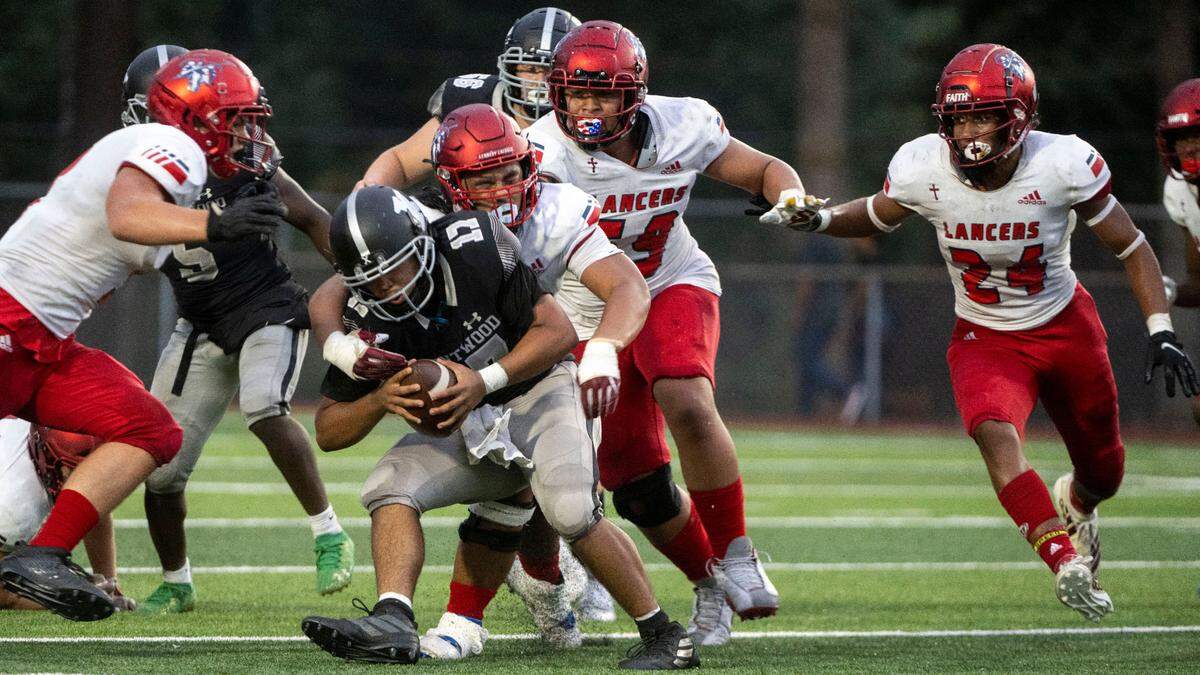 Kennedy Catholic defensive lineman Ish Taliauli sacks Kentwood quarterback Anthony Tucker in the second quarter of a 4A NPSL game on Thursday, Sept. 15, 2022, at French Field in Kent, Wash.