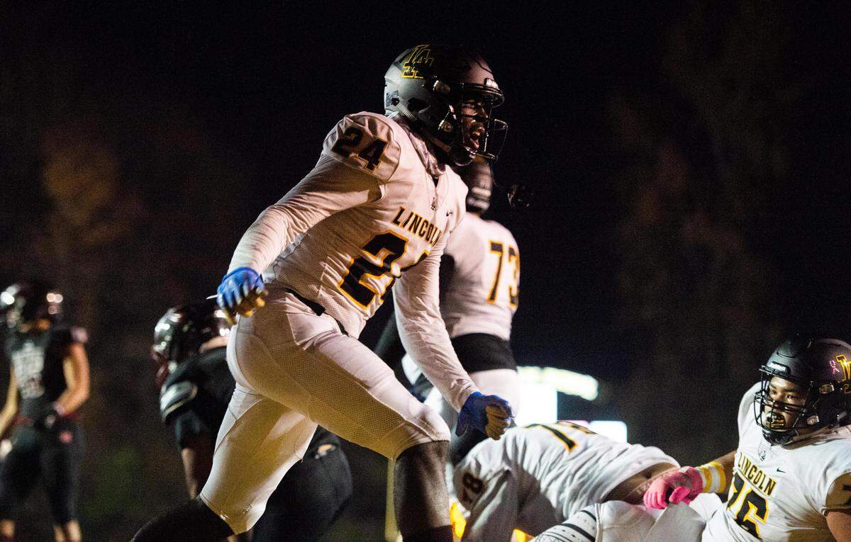 Lincoln’s Julien Simon celebrates a touchdown ru during the second quarter. Lincoln played Bethel in a a football game at the Lincoln Bowl in Tacoma, Wash., on Friday, Nov. 1, 2019.