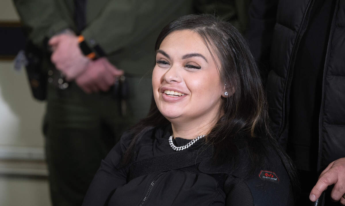 Domestic-violence survivor Selena Loredo smiles during ceremonies at the Tacoma Police Department in Tacoma, Washington, on Thursday, Dec. 5, 2024. SWAT officers rescued her from a hostage situation with her ex-boyfriend in July, where she had been shot in the head.
