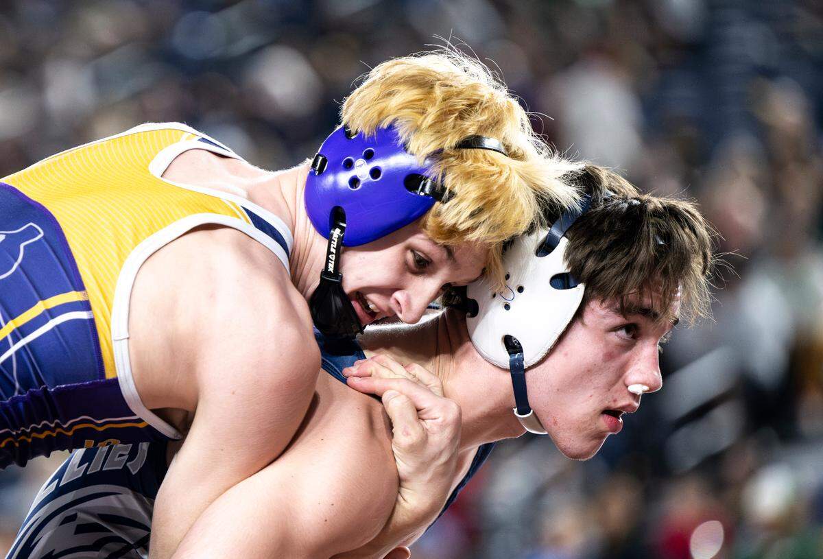 Sumner’s Cody Miller controls Glacier Peak’s Colin Edmonds in the 175-pound 4A quarterfinal during day one of the Mat Classic XXXV at the Tacoma Dome on Friday, Feb. 16, 2024, in Tacoma, Washington.