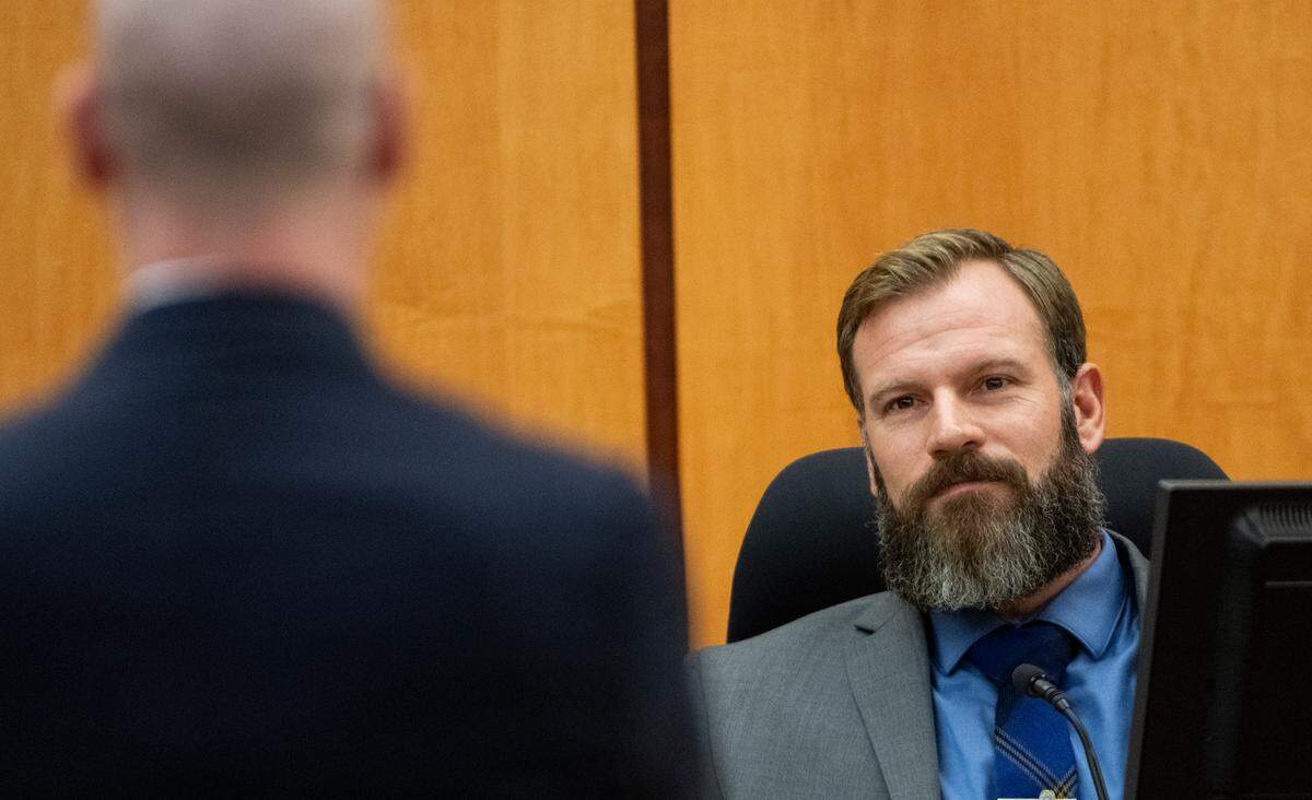Defendant Matthew Collins testifies in Pierce County Superior Court on Monday under direct examination by his attorney Jared Ausserer during the trial of three Tacoma police officers in the killing of Manny Ellis.