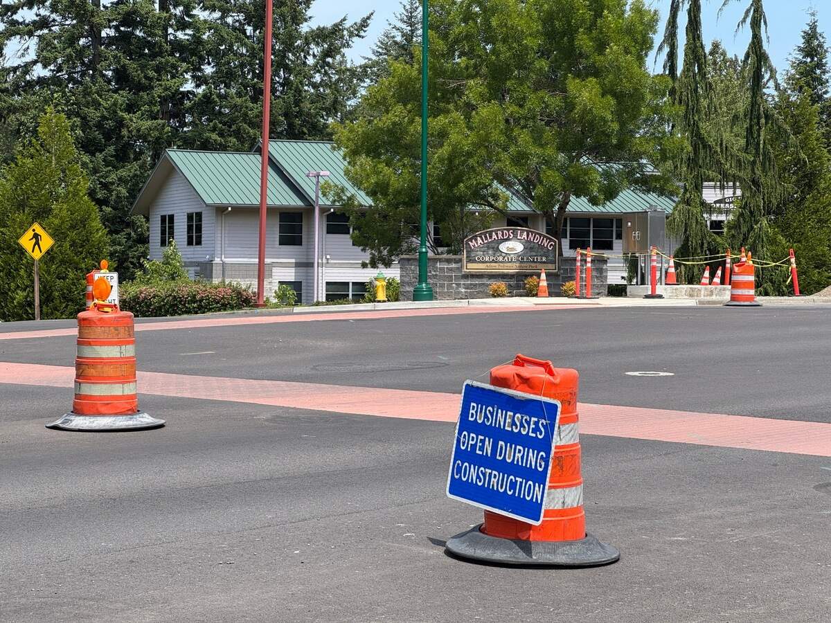 A sign indicates that businesses remain open near the construction site around Wollochet Drive and Wagner Way Northwest Monday, June 23, 2025, in Gig Harbor, Wash.