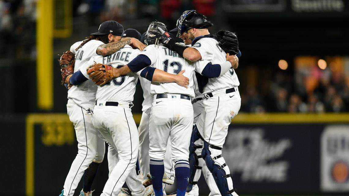Seattle Mariners dance after a 3-1 victory over the Texas Rangers in a baseball game Wednesday, Sept. 28, 2022, in Seattle. (AP Photo/Caean Couto)