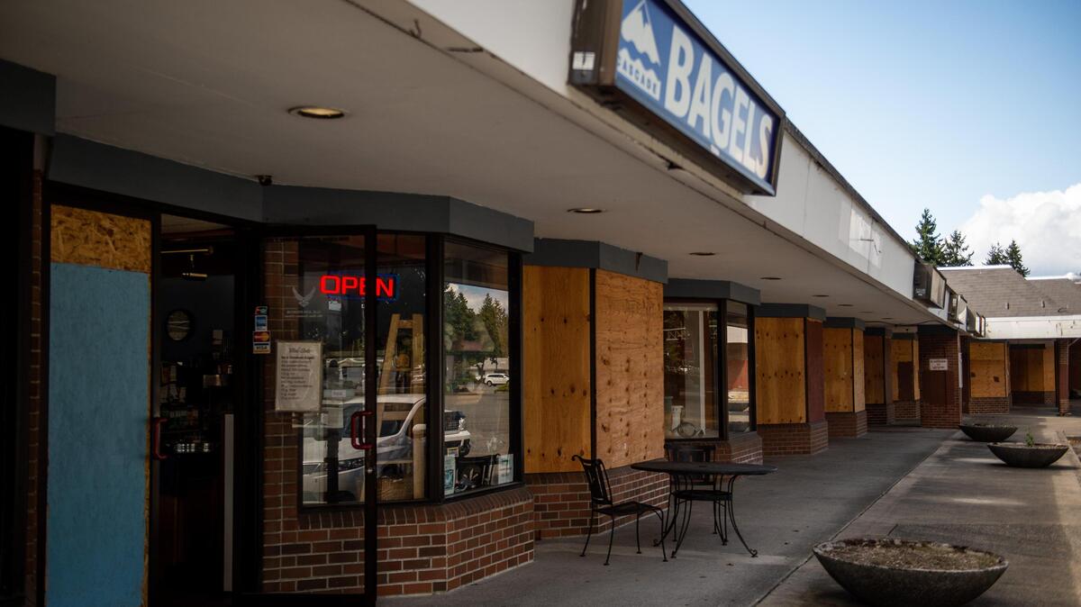 Cascade Bagel and Deli is seen among various shuttered shops in Lakewood, on Aug. 12, 2019. The city is considering buying the strip mall in order to build a park.
