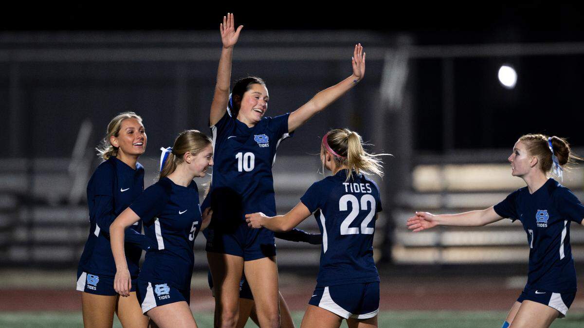 Gig Harbor’s Karin Heikkila (10) and teammates celebrate Heikkila’s first goal against Peninsula during the first half of the Class 3A district 3/4 girls soccer championship at Mount Tahoma High School on Thursday, Nov. 7, 2024 in Tacoma, Wash.