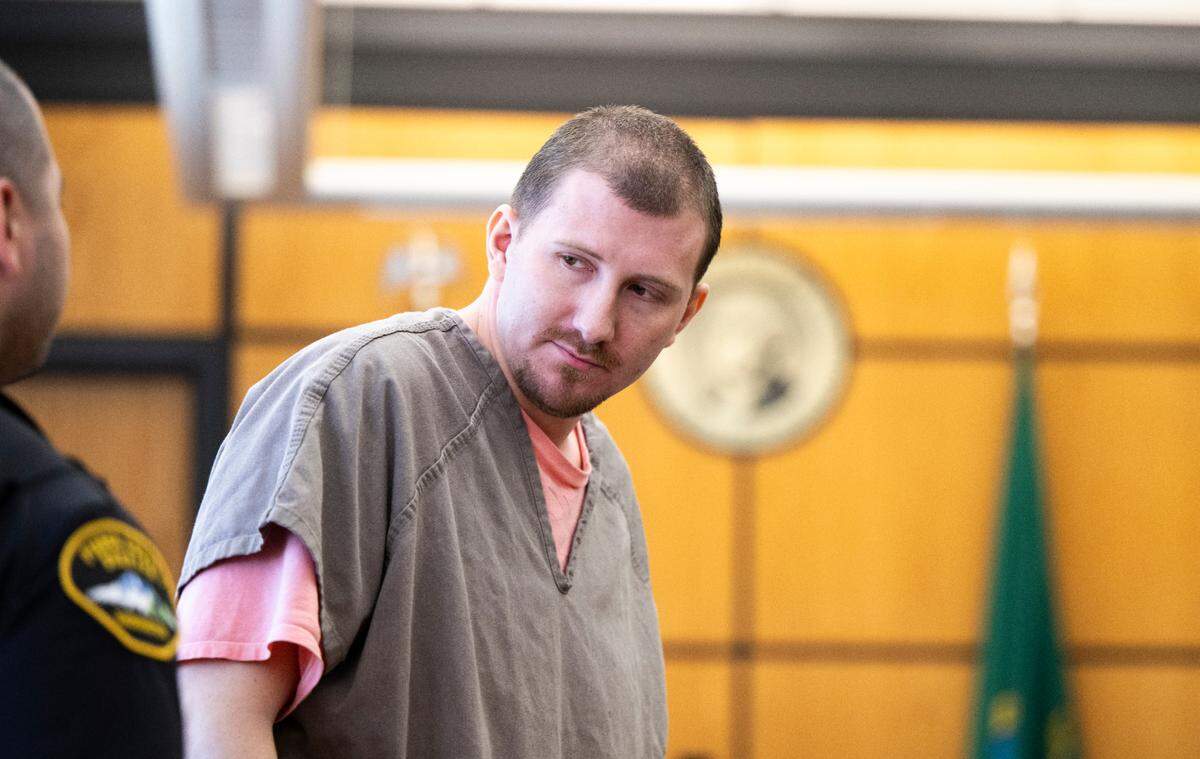 Paul Michael Snider, 29, walks back to holding after being sentenced for murdering three people in Tacoma between Sept. 4 and Nov. 21, 2022, at Piece County Superior Court, on Friday, April 12, 2024, in Tacoma, Wash. Snider pleaded guilty to two counts of second-degree murder and one count of first-degree murder.