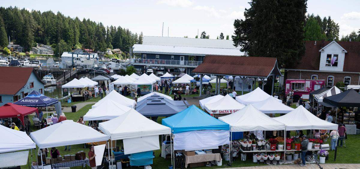 Vendors fill Skansie Brothers Park and Netshed for Waterfront Farmers Market, on Thursday, May 22, 2025, in Gig Harbor, Wash.