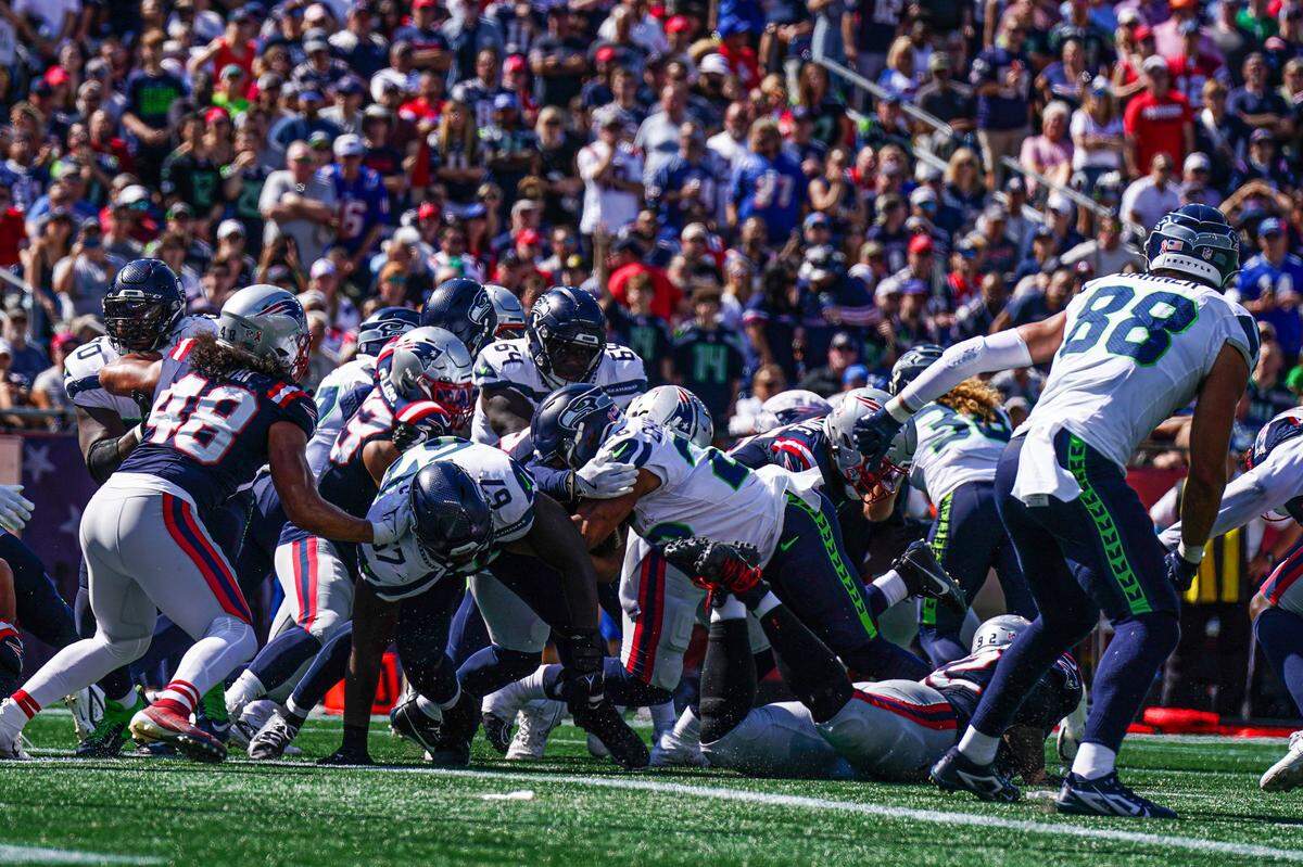 Sep 15, 2024; Foxborough, Massachusetts, USA; Seattle Seahawks running back Zach Charbonnet (26) runs the ball for a touchdown against the New England Patriots in the second quarter at Gillette Stadium. Mandatory Credit: David Butler II-Imagn Images