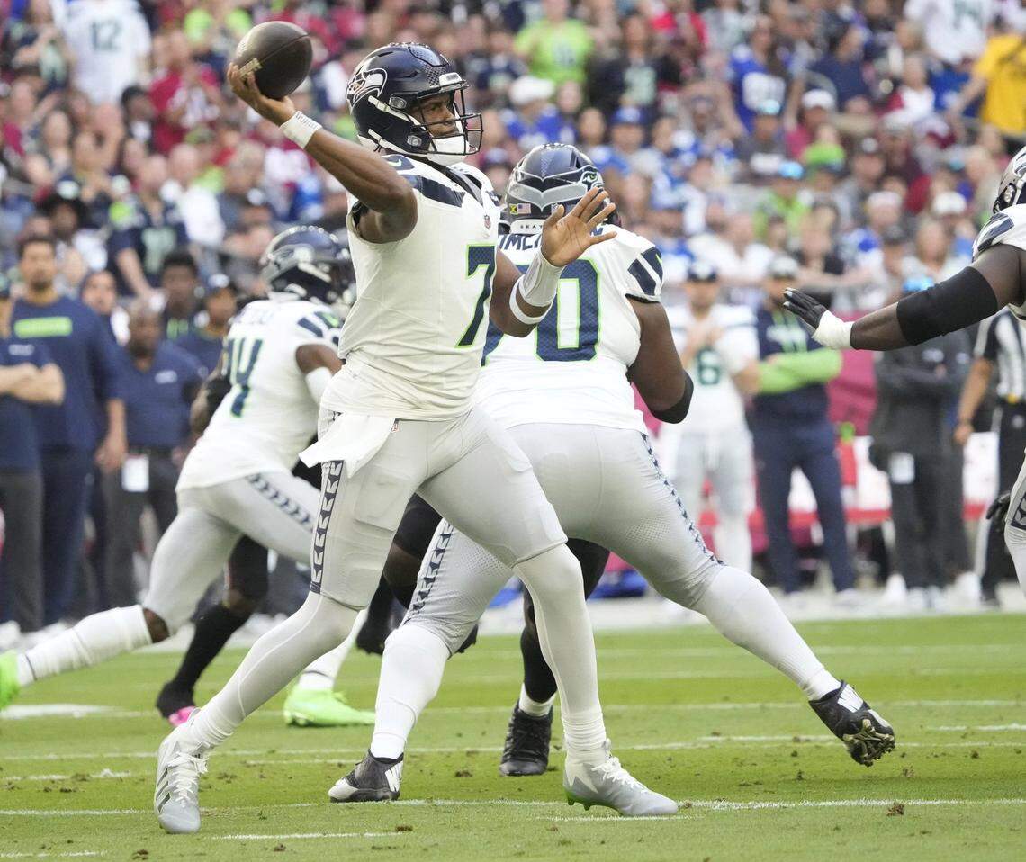 Seattle Seahawks quarterback Geno Smith (7) throws against the Arizona Cardinals during the first quarter at State Farm Stadium in Glendale on Dec. 8, 2024.