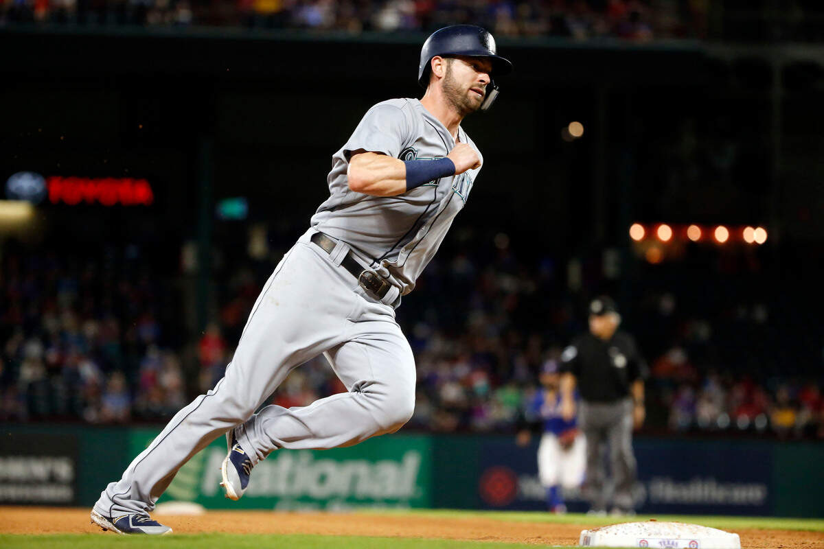 Seattle Mariners’ Mitch Haniger runs around third base on his way to scoring on a double by Robinson Cano during the eighth inning of a baseball game against the Texas Rangers, Saturday, Sept. 22, 2018, in Arlington, Texas. (AP Photo/Michael Ainsworth)