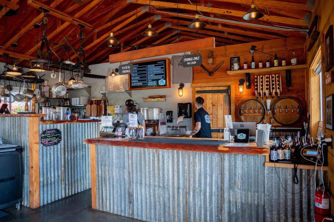 Order food and drink at the counter inside the Mill Haus taproom. The draft system is to the right and the small kitchen to the left.