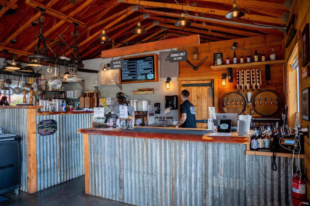 Order food and drink at the counter inside the Mill Haus taproom. The draft system is to the right and the small kitchen to the left.