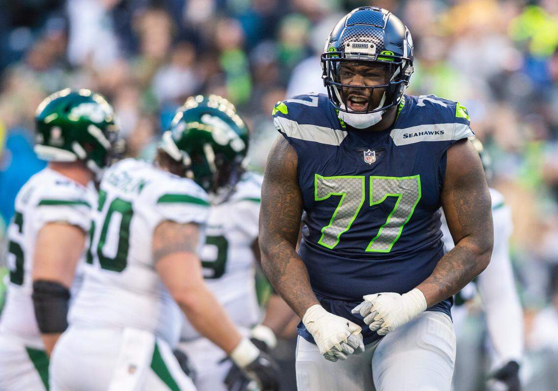 Seattle Seahawks defensive tackle Quinton Jefferson (77) celebrates after making a tackle in the fourth quarter of an NFL game against the New York Jets at Lumen Field in Seattle Wash. on Jan. 1, 2023. The Seahawks defeated the Jets 23-6.
