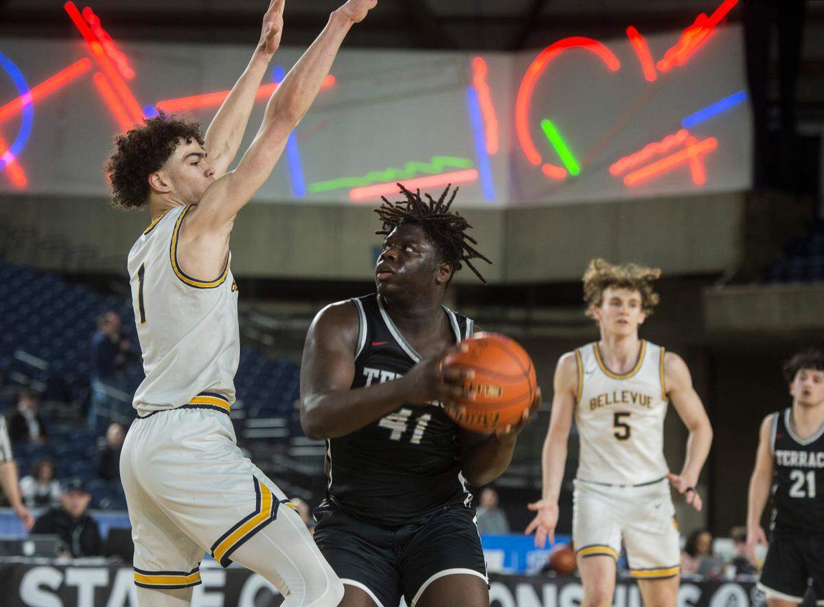 Mountlake Terrace forward Zaveon Jones (41) looks to shoot as Bellevue defends in the consolation round of the Class 3A boys state basketball tournament on Friday, March 3, 2023 at the Tacoma Dome in Tacoma, Wash.