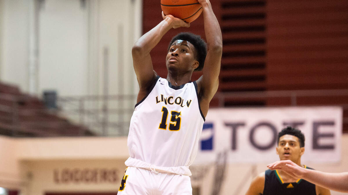 Lincoln guard Isaiah Cunningham (15) jumps to shoot the ball during a game at the Puget Sound Holiday Classic Tournament in the Memorial Field-house in Tacoma, Wash. on Jan. 16, 2023. Lincoln lost to Roosevelt 59-66.