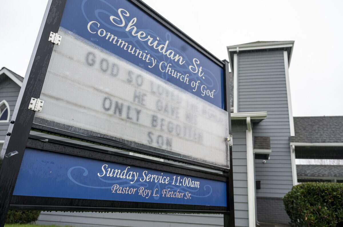 Pastor Roy Fletcher's name is visible on the marque outside of Sheridan Street Community Church of God, pictured on Friday, Nov. 14, 2025, in Tacoma, Wash. Fletcher announced his retirement after six decades of service at the church.