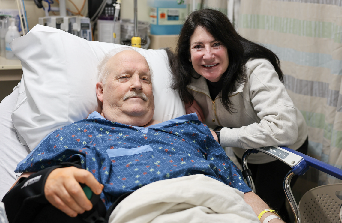 Chris Anderson and his wife, Kathi, following Anderson’s shoulder replacement surgery at St. Clare Hospital in Lakewood. Anderson was the first patient to undergo the robot-assisted procedure at the hospital.