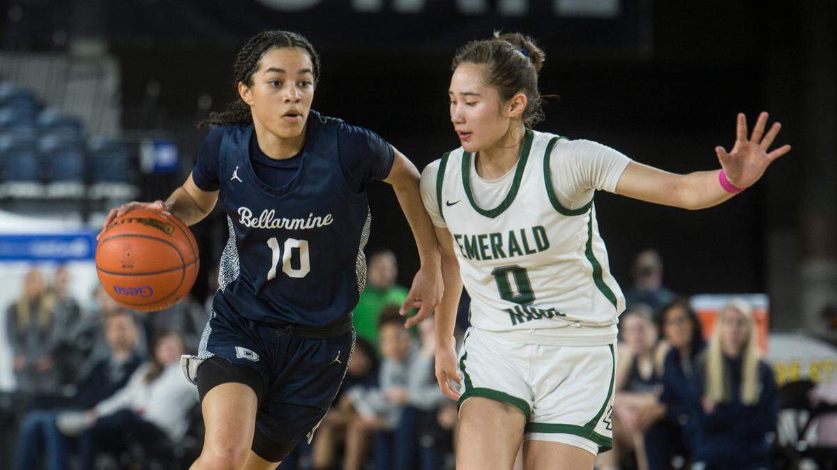 Bellarmine Prep guard Keiara Curtis (10) drives as Emerald Ridge guard Naomi Senato (0) defends in the consolation round of the Class 4A girls state basketball tournament on Friday, March 3, 2023 at the Tacoma Dome in Tacoma, Wash.