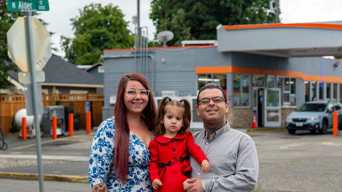 Cristian and Katrina Conversano pose with their daughter, Italy, on Aug. 30 across from the gas station at North 26th and Alder in Tacoma’s North End. They had operated a food truck, Italy Paola Pizza Napoletana, here until mid-August.
