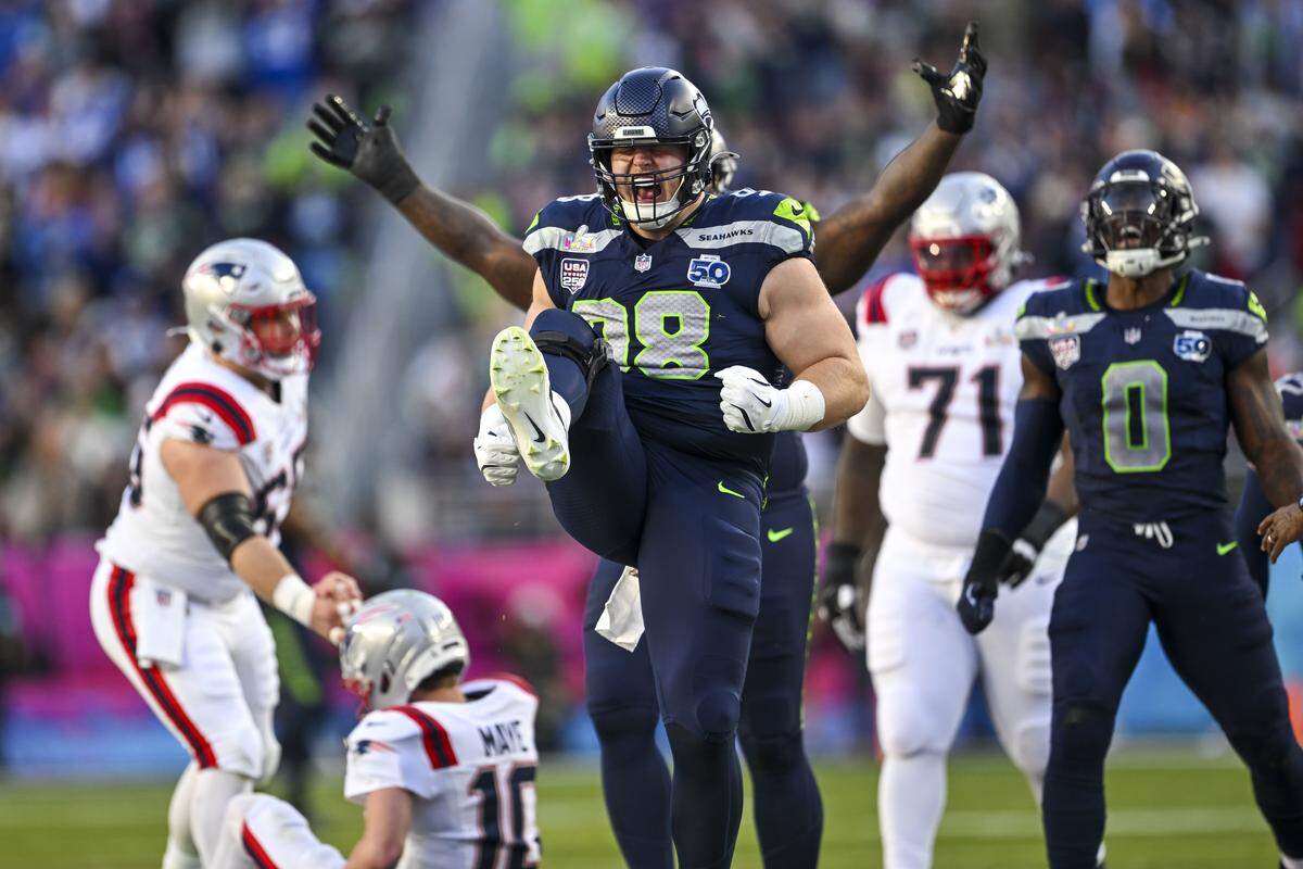 Seattle Seahawks defensive tackle Rylie Mills (98) celebrates after sacking New England Patriots quarterback Drake Maye (10) during the second quarter of Super Bowl LX at Levi's Stadium on Feb. 8, 2026 in Santa Clara, Calif.