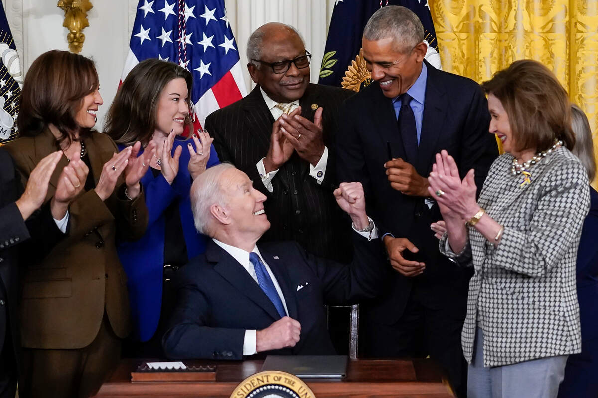 President Joe Biden looks to former President Barack Obama after signing an executive order during and event about the Affordable Care Act, in the East Room of the White House in Washington, Tuesday, April 5. Also seen are Vice President Kamala Harris, Rep. Angie Craig, D-Minn., House Majority Whip James Clyburn, D-S.C., and House Speaker Nancy Pelosi of Calif.