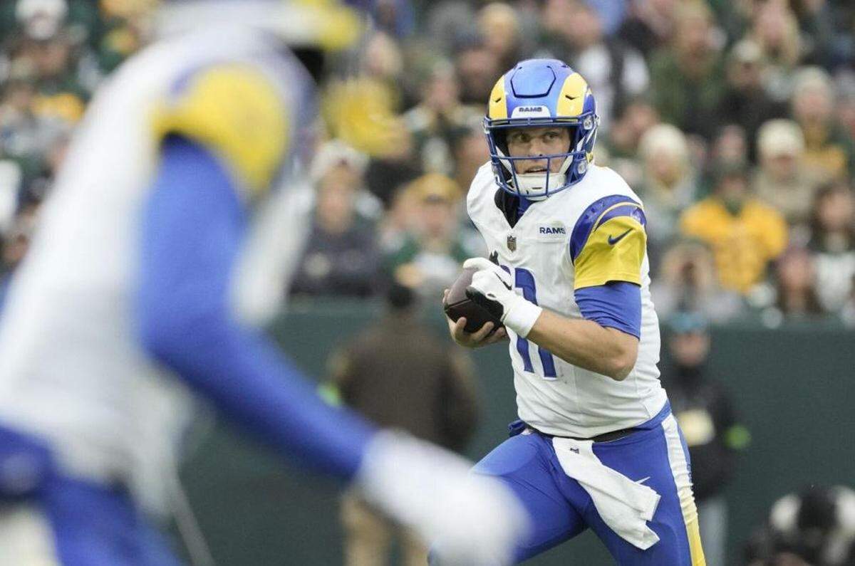 Los Angeles Rams’ Brett Rypien runs during the first half of an NFL football game against the Green Bay Packers Sunday, Nov. 5, 2023, in Green Bay, Wis.