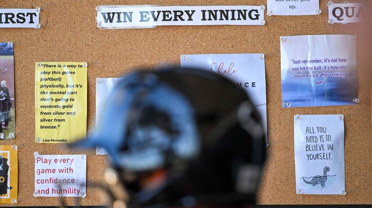 A cork board with motivational phrases hangs in the Panther’s dugout during the softball game against Lincoln at Bonney Lake High School, on Thursday, April 18, 2024, in Bonney Lake, Wash.