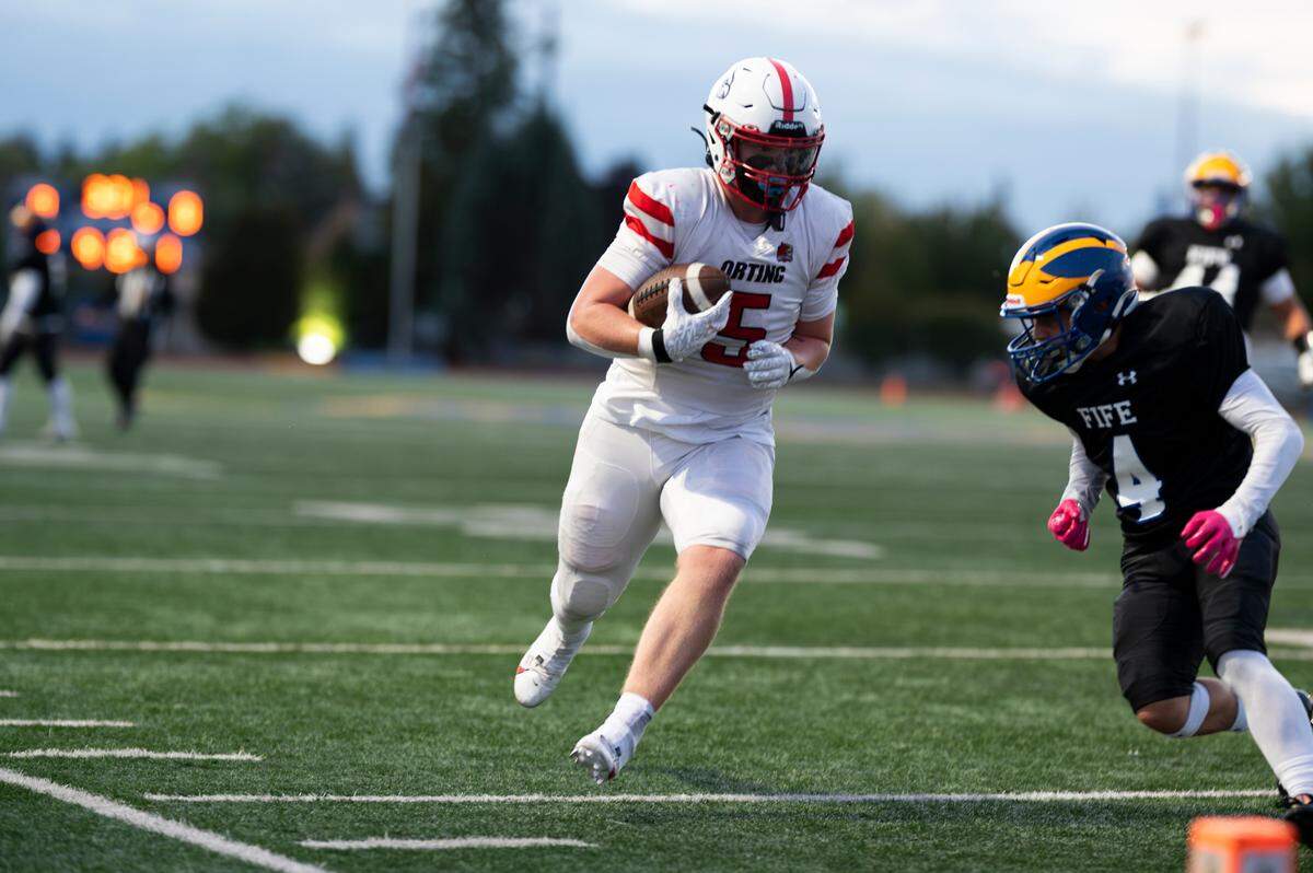 Orting running back Carson McCall (5) carries the ball during the first half of the game against Fife at Fife High School, on Friday, Sept. 20, 2024, in Fife, Wash. 