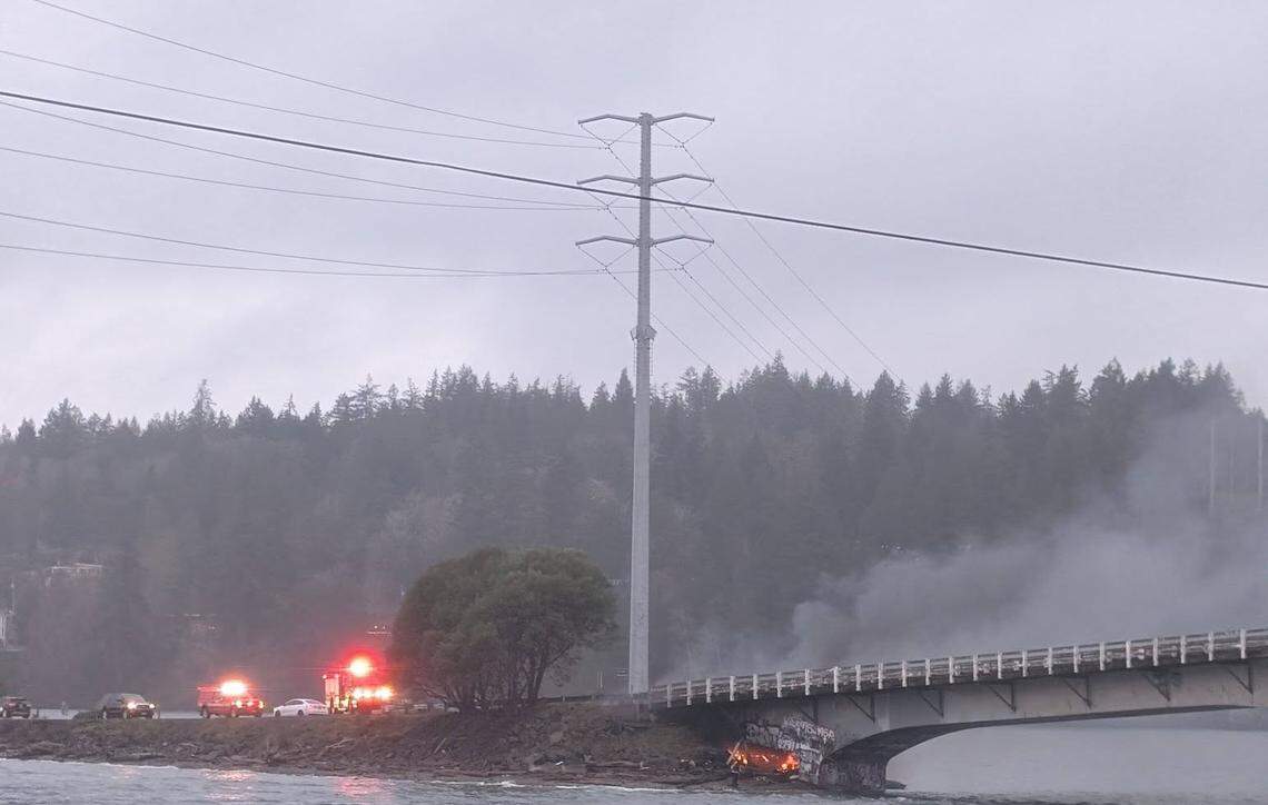 A fire that broke out under the Purdy Bridge Friday, Jan. 9, 2026 sent smoke billowing over the bridge.