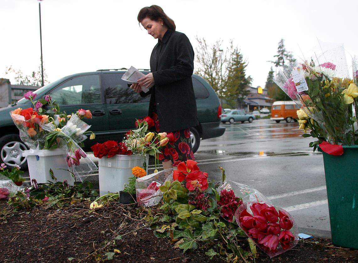 Gig Harbor resident Sarah Bennett-Bower reflects at memorial for Crystal Judson at the site where she was shot.