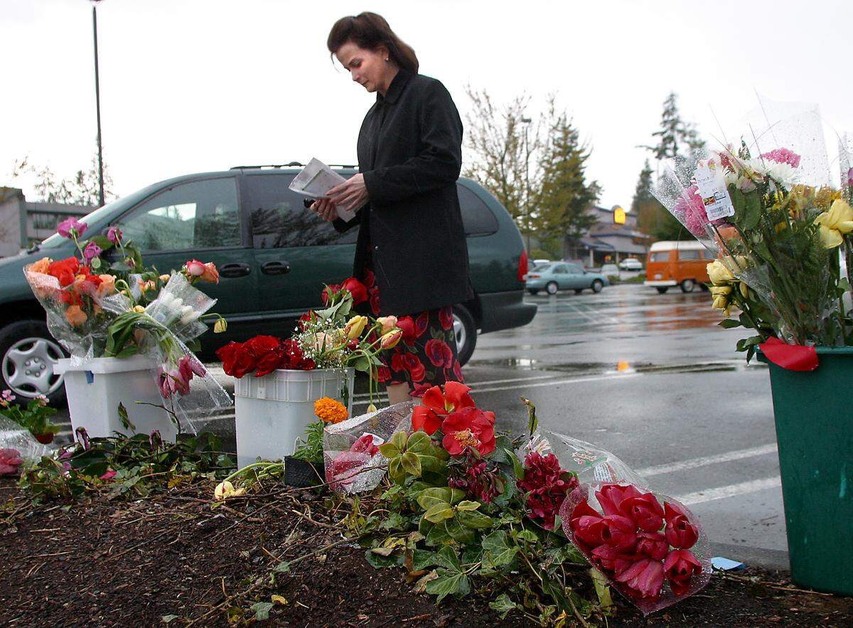 Gig Harbor resident Sarah Bennett-Bower reflects at memorial for Crystal Judson at the site where she was shot.
