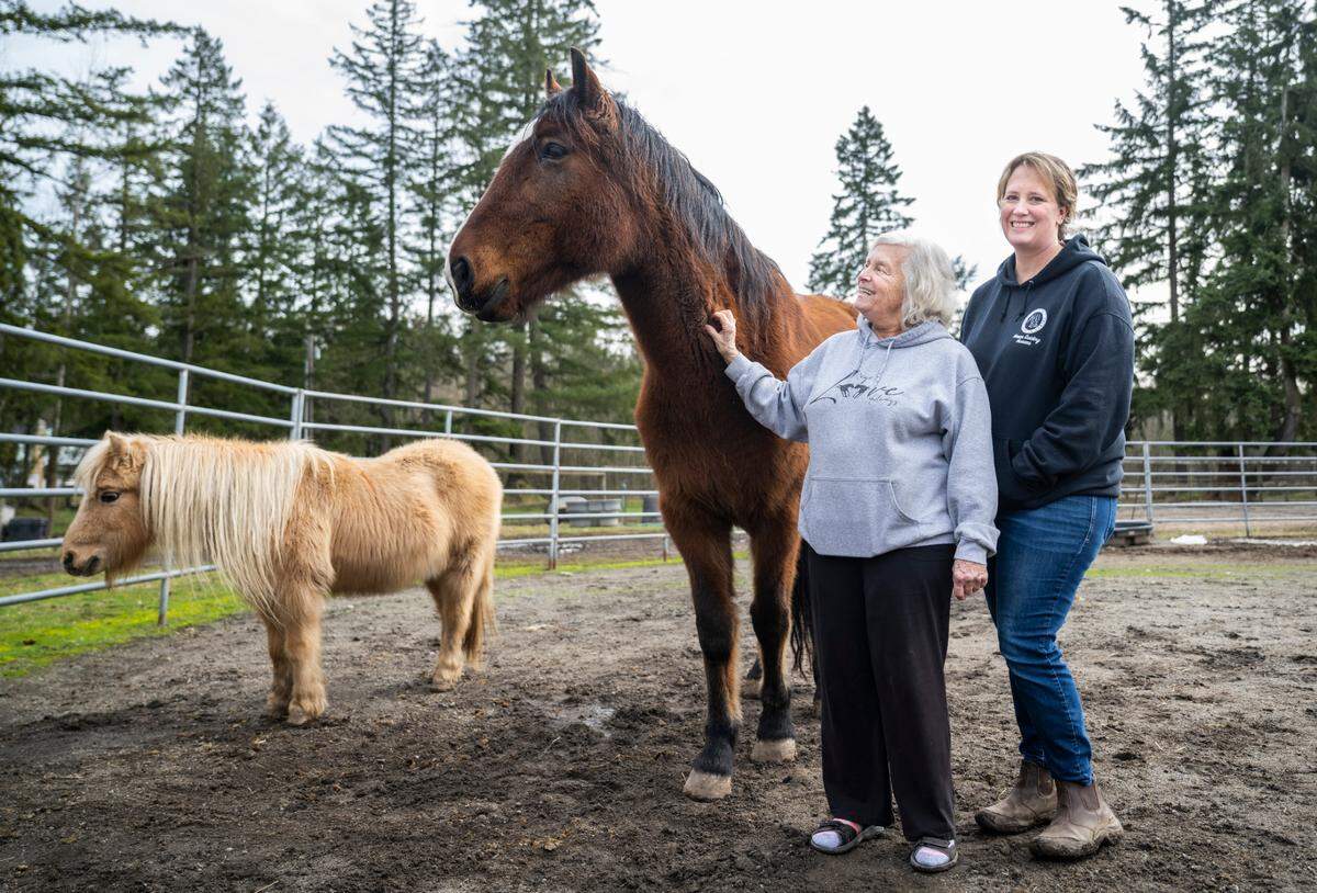 Sharon Lulham, left, and her daughter, Sholeh Lulham-New, right, co-owners of Four Star Farms. The nonprofit, Horses Guiding Humans, is operated there. It helps over 50 clients receive equine-assisted mental health therapy each week. Photographed in Graham on Jan. 31, 2023.