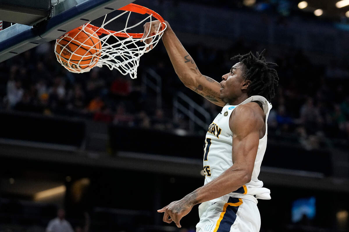 Murray State forward Jordan Skipper-Brown dunks the ball during the first half of a college basketball game against San Francisco in the first round of the NCAA tournament, Thursday, March 17, 2022, in Indianapolis. (AP Photo/Darron Cummings)