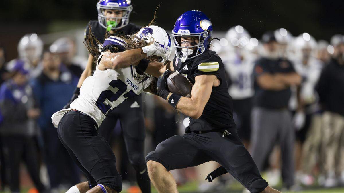 Puyallup wide receiver Jayden Woodland (2) spins out of the tackle of Sumner free safety Elias Isaacs (27) during the first half of the game at Sparks Stadium, on Saturday, Oct. 4, 2025, in Puyallup, Wash.