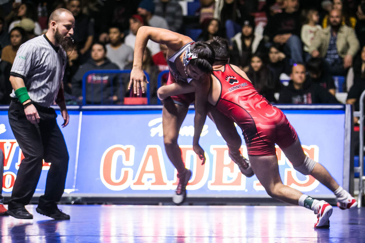 Toppenish High’s Haiden Drury, left, battles Sunnyside High’s Andrew Macias in a 132-pound bout during the fifth annual Cadet Classic at Eisenhower High School, on Saturday, Dec. 15, 2018. Drury finished second in his weight class as the Zinkin Classic wrestling tournament on Saturday, Dec. 22, 2018, in Clovis, Calif., helping the Wildcats place fifth.