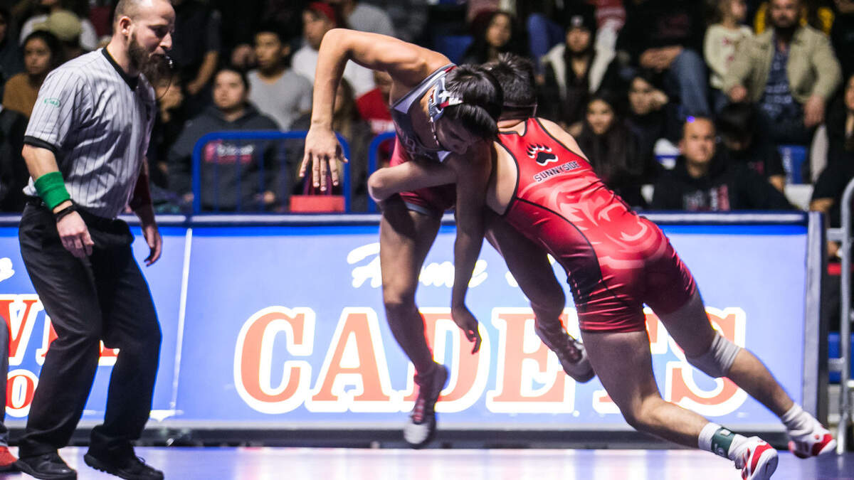 Toppenish High’s Haiden Drury, left, battles Sunnyside High’s Andrew Macias in a 132-pound bout during the fifth annual Cadet Classic at Eisenhower High School, on Saturday, Dec. 15, 2018. Drury finished second in his weight class as the Zinkin Classic wrestling tournament on Saturday, Dec. 22, 2018, in Clovis, Calif., helping the Wildcats place fifth. (Amanda Ray, Yakima Herald-Republic file).