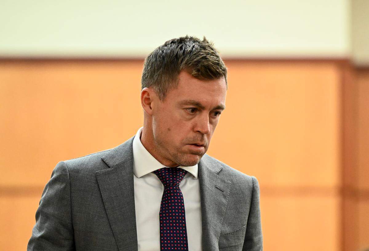 Defense attorney Casey Arbenz walks back to the defense’s table after cross examining Brian Petersen, a Pierce County Sheriffs Department detective, during the trial of three Tacoma Police officers in the killing of Manny Ellis.