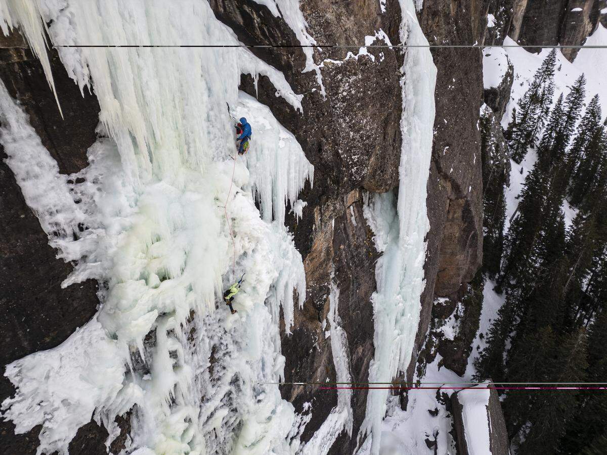 Kimberly Cross and Elias de Andres-Martos climb Bridalveil Falls in Telluride. 