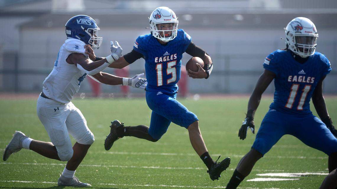 Graham-Kapowsin quaterback Daveon Superales tries to scramble away from Curtis linebacker Kane Able during Saturday’s football game at Art Crate Field in Spanaway, Washington, Oct. 8, 2022. Graham-Kapowsin won the game, 24-19.