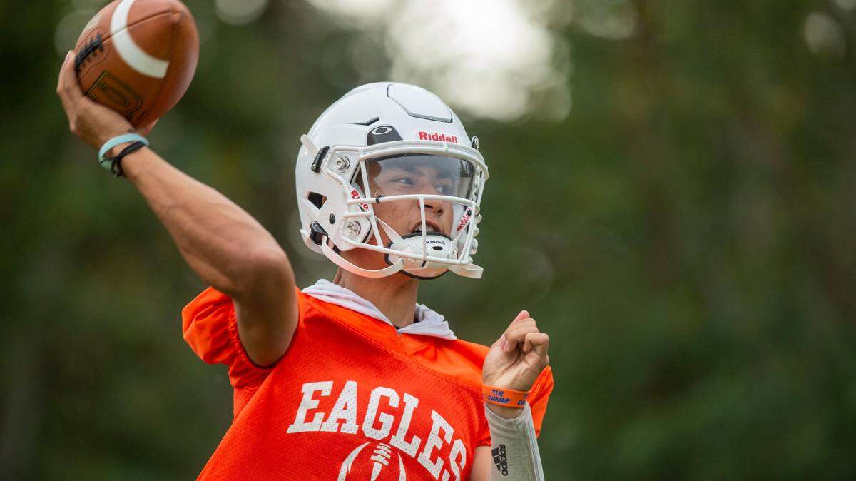 Graham-Kapowsin quarterback Daveon Superales winds up to throw a pass during drills on Thursday, Aug. 18, 2022, at Graham Kapowsin High School, in Graham, Wash.