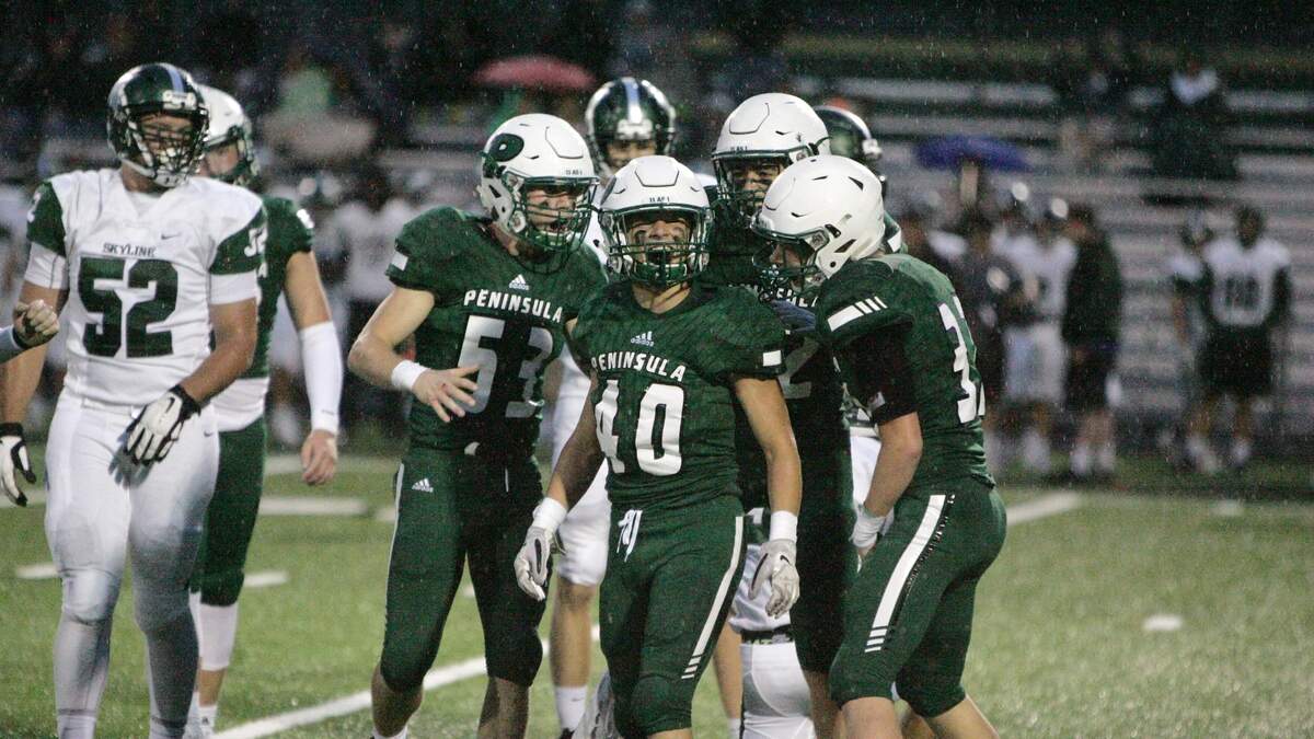 Peninsula linebacker Nolan Casey celebrates a sack with his teammates against Skyline High at Roy Anderson Field. The Seahawks topped the Spartans, 32-20.