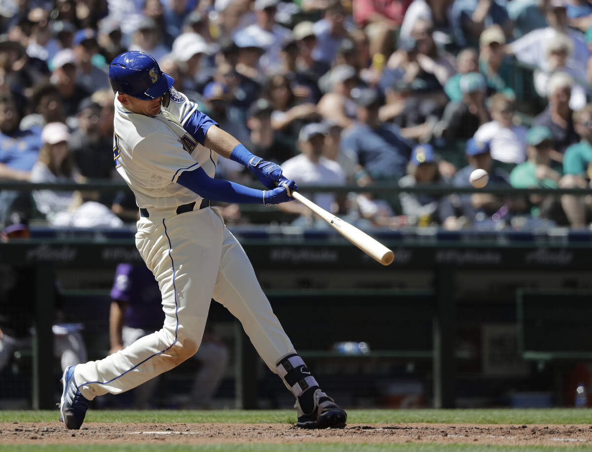 Seattle Mariners' Ryon Healy hits a three-run home run against the Colorado Rockies during the sixth inning of a baseball game, Sunday, July 8, 2018, in Seattle. (AP Photo/Ted S. Warren)