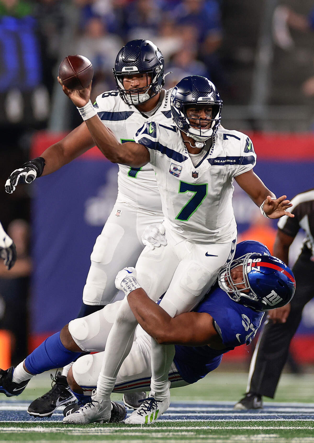 New York Giants defensive tackle Dexter Lawrence II (97) sacks Seattle Seahawks quarterback Geno Smith (7) during the third quarter of an NFL football game, Monday, Oct. 2, 2023, in East Rutherford, N.J. (AP Photo/Adam Hunger)