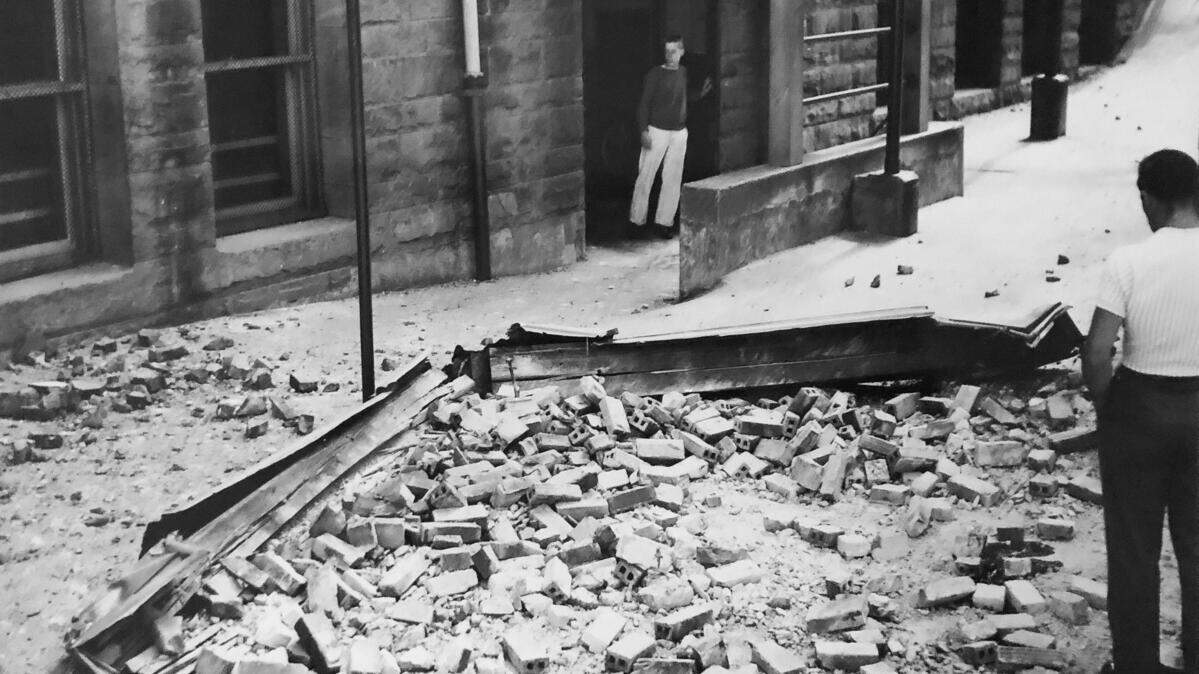 In this April 13, 1949 photograph, brick debris at the Lowell School marks the location of Marvin Klegman’s death during the 1949 earthquake. The bricks fell from the fourth floor of the school.